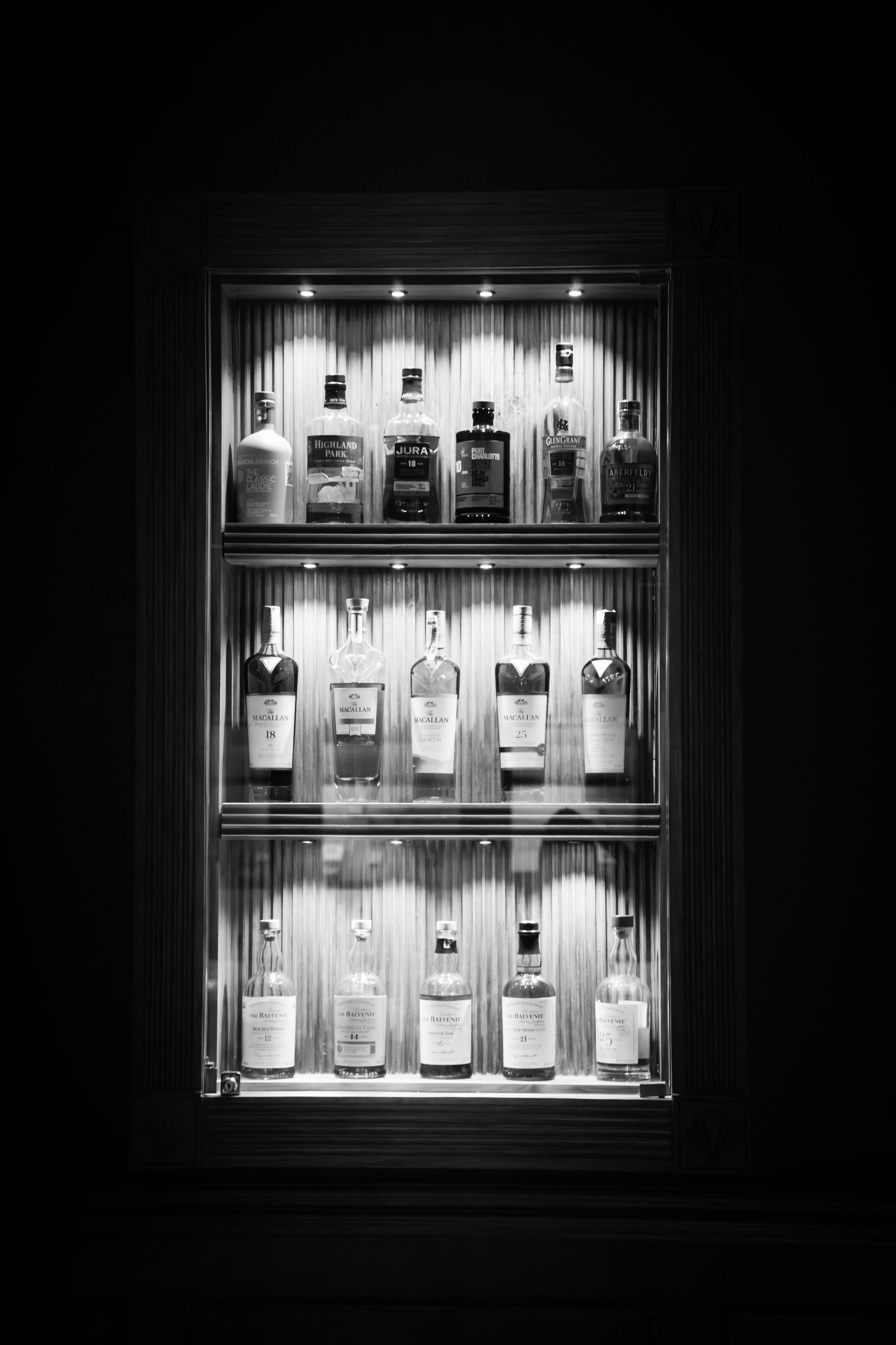 Khloé Kardashian × Munkeybarz, Bali — The Cabinet, a backlit whisky cabinet